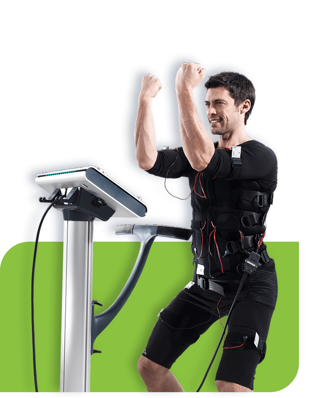 Athlete wearing EMS suit training beside EMS machine